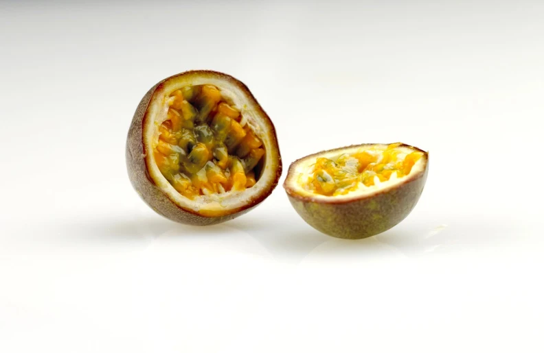 a half eaten passion fruit and it's contents