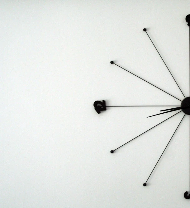 a clock that has a black face and black hands