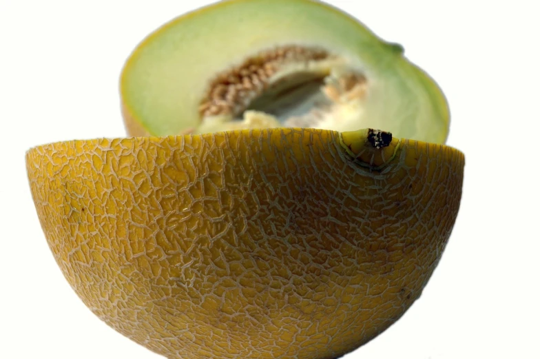 an open cantaloupe and a sliced avocado