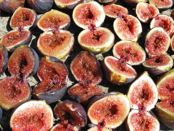 fresh figs cut in half sitting on a table