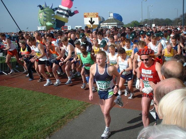 a group of people run in an outdoor marathon