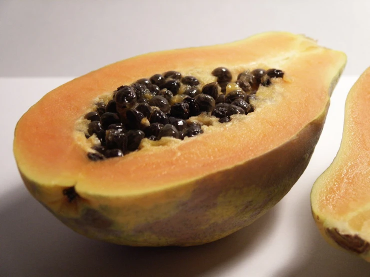 two pieces of ripe fruit on a table