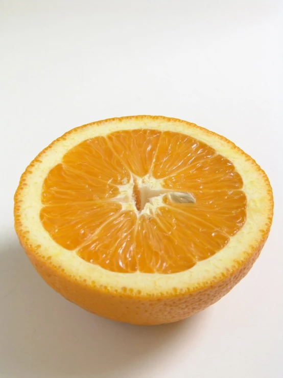 a slice of orange sitting on top of a table