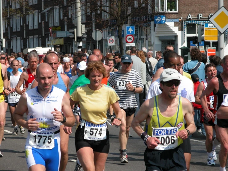 people running in a marathon on the road