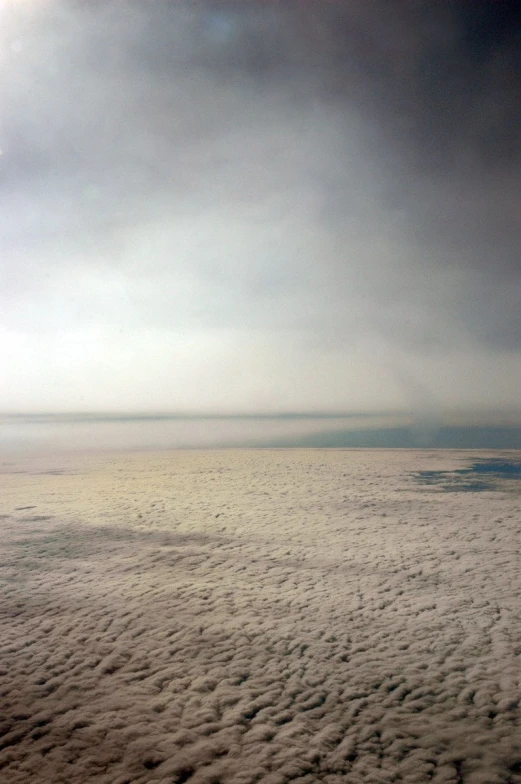 a plane in the air with a view of clouds