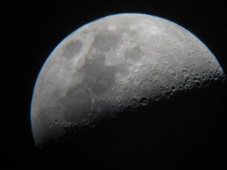 the moon is almost clear, as it reflects a black sky