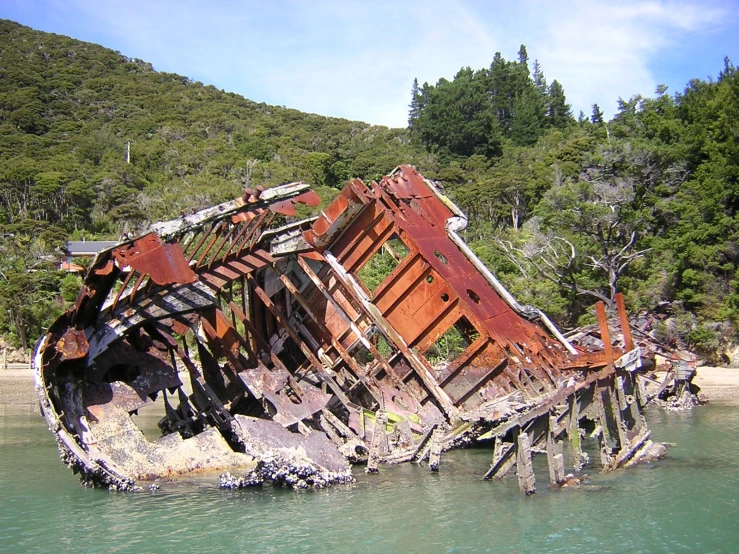 a boat sitting in the water with lots of junk