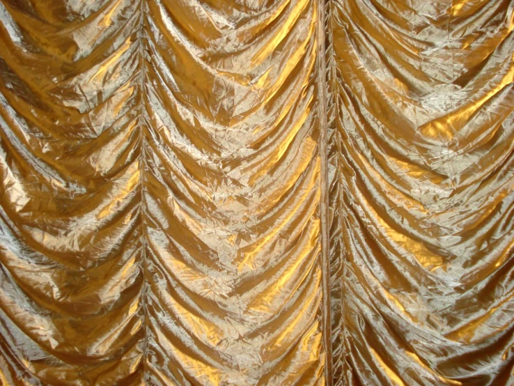 a very pretty shiny gold curtains with light colors