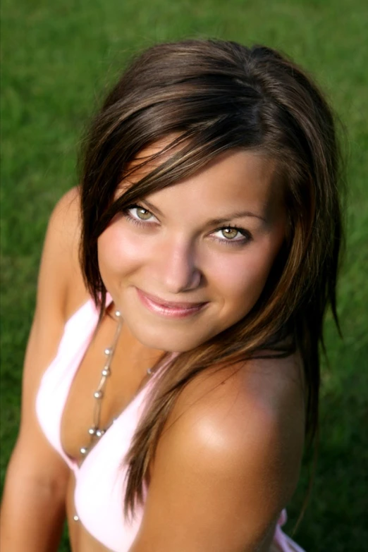 the beautiful woman is posing for the picture in her swimsuit