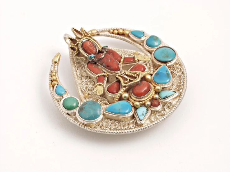 a brooch with stones on it