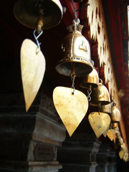 three different kinds of bell hanging from ceiling