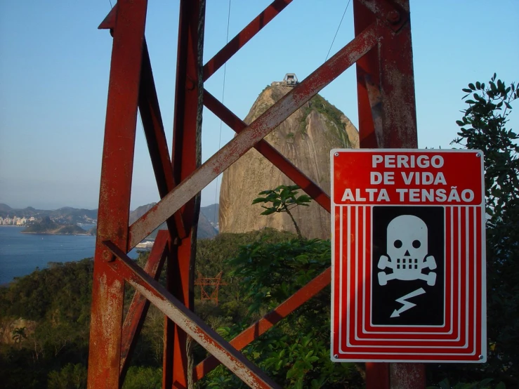 a red sign is attached to a wooden structure