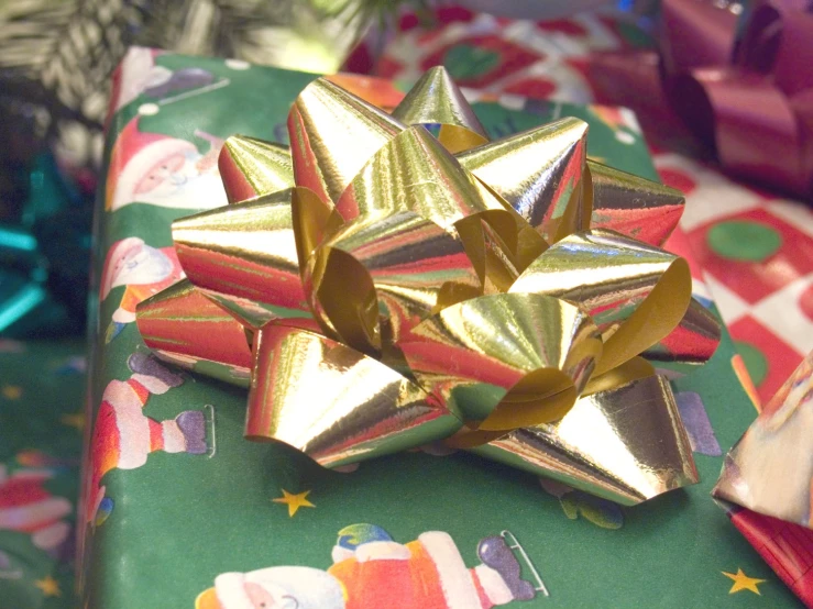 this is a present wrapped in gold and red paper