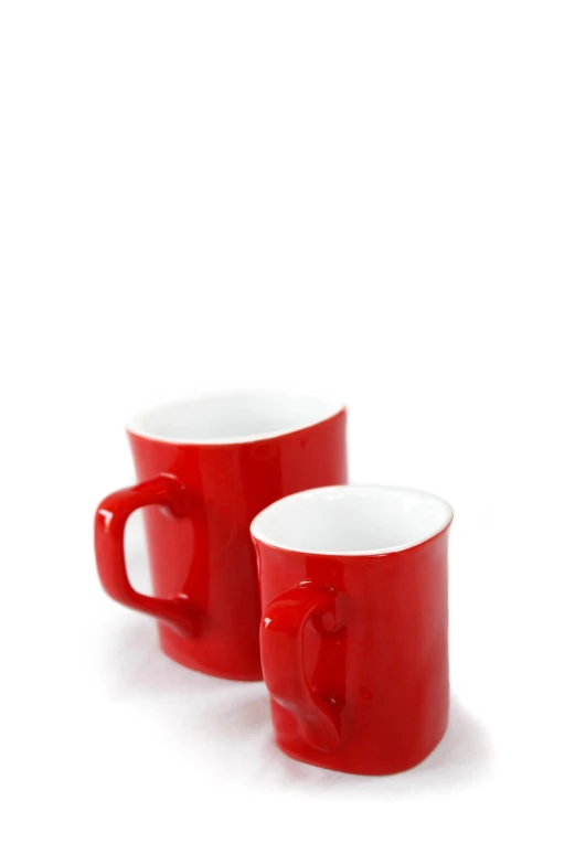 a pair of red cups on a white background