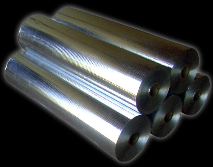 a closeup s of several cylinders sitting in the dark