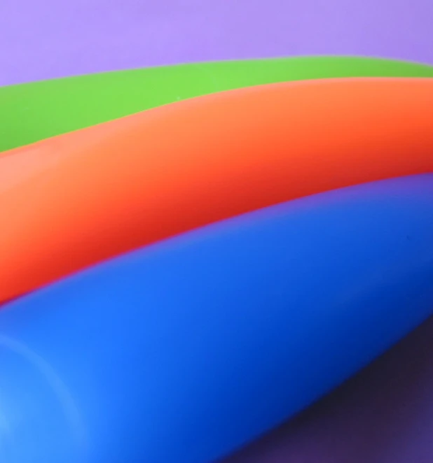 three colorful tubes of a different colored design