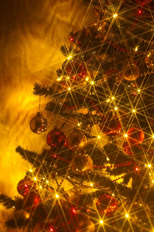 christmas tree with ornaments and lights lit up