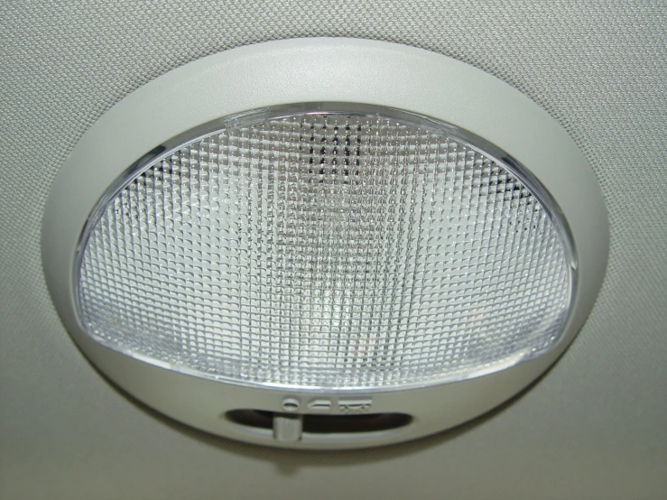 a chrome finish light on an air conditioner