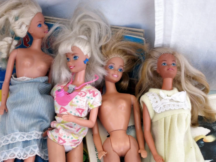 a group of dolls that are in a drawer