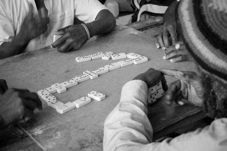 a black and white po of people playing a board game