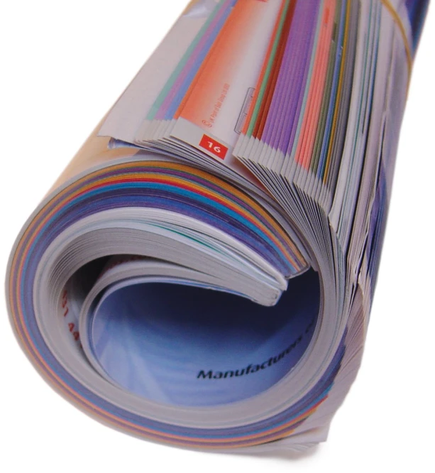 a stack of multicolored papers lay out