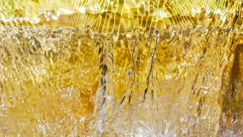 the top of an orange and yellow waterfall