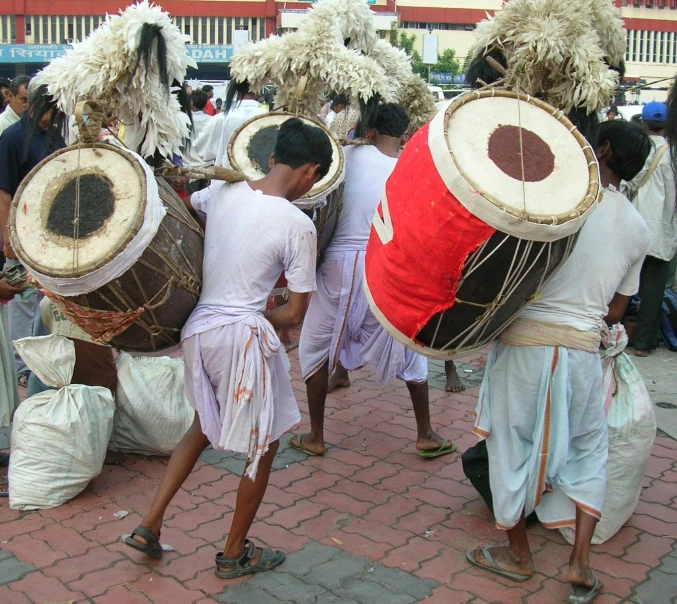 group of men in traditional clothing performing a traditional dance