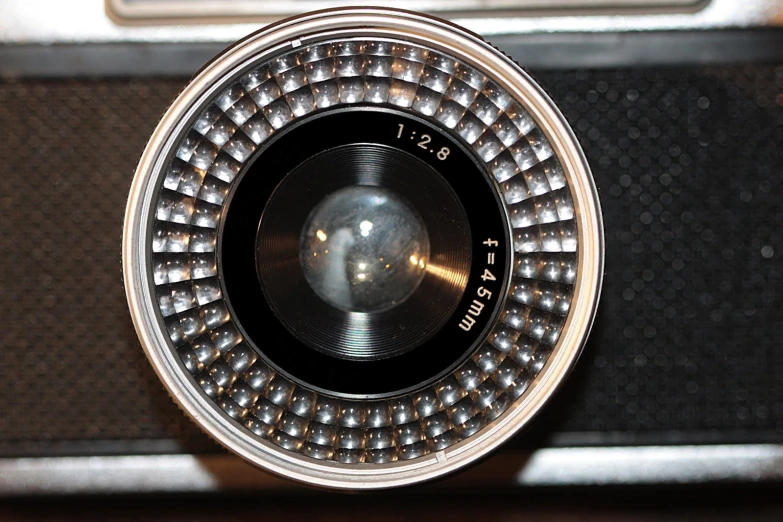 a silver and black digital camera on display