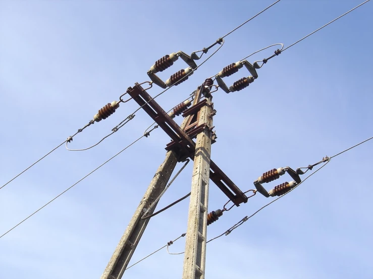 an electric pole with several wires on top