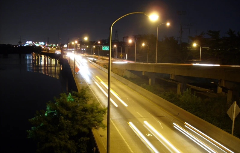 cars going by on a night time highway