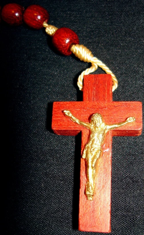 a wooden crucifix on a black background