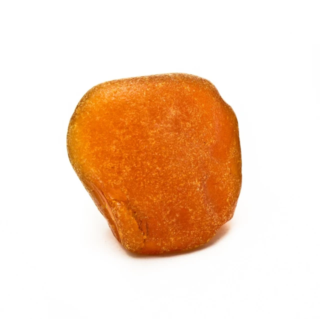 a orange on a white surface