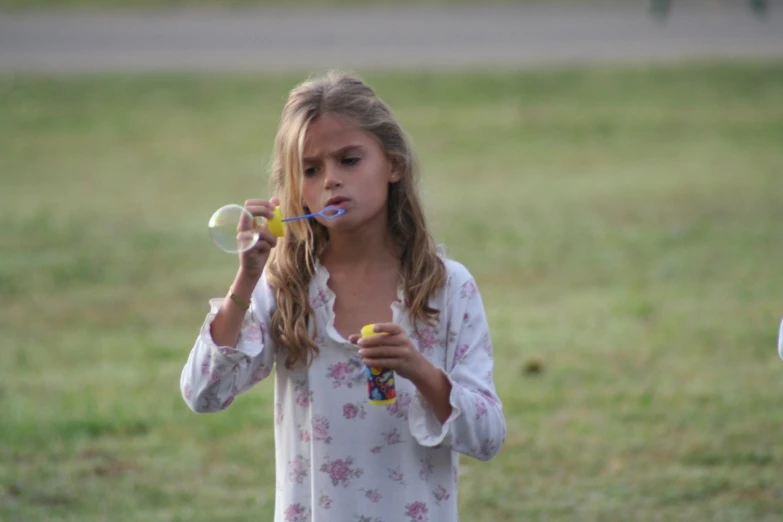 a  is holding a yellow object in her hands