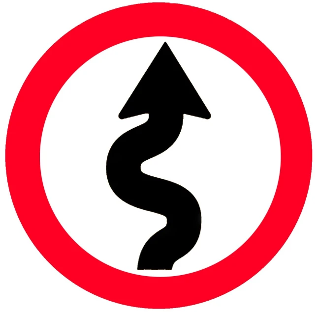 a sign that shows an arrow with a road going into the center