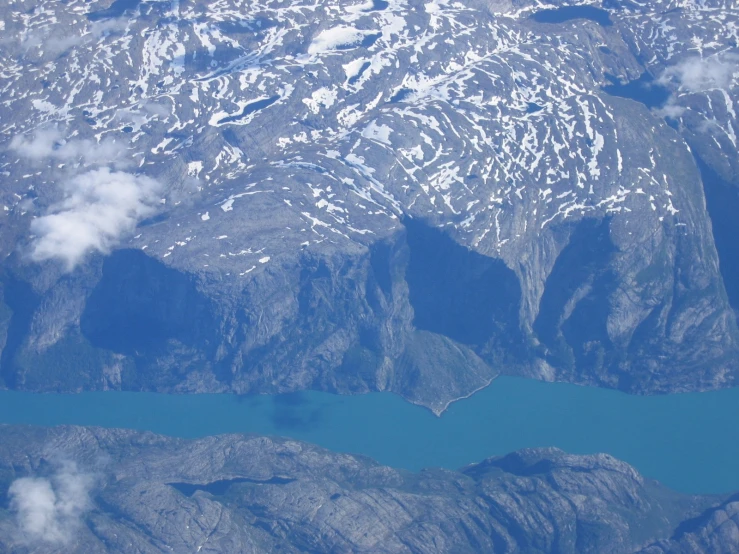 view of a mountain range from an airplane window