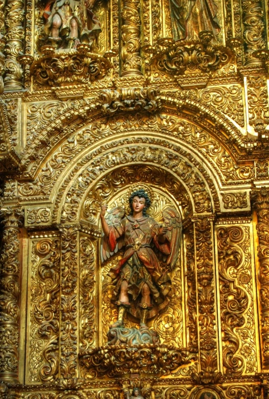the elaborately painted wall in this cathedral has intricate decorations