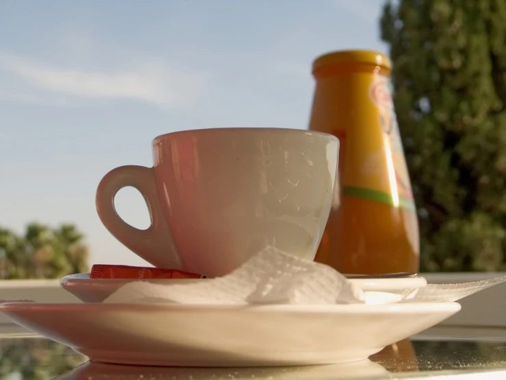 two cups on a plate next to each other