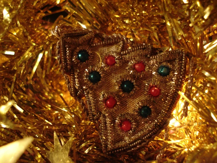 a handbag on top of some gold tinsel