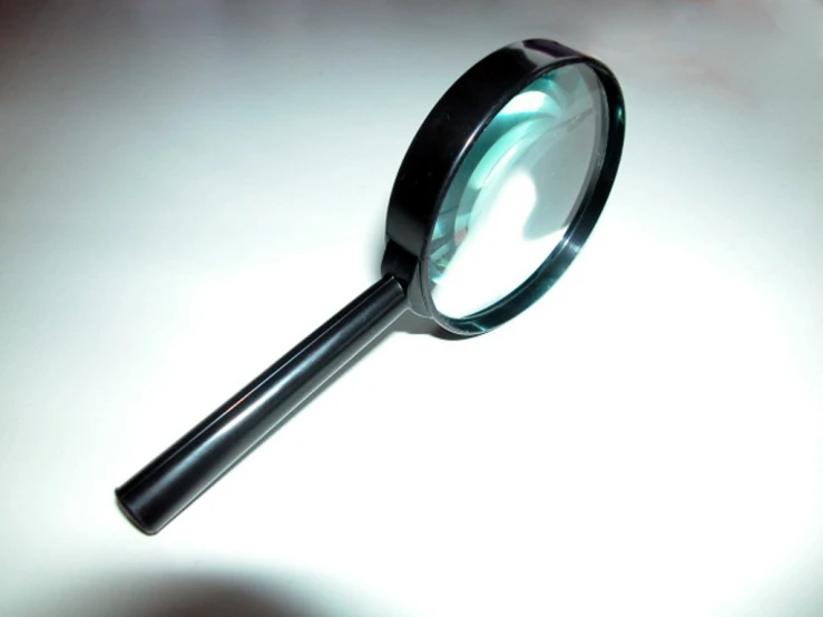 a black magnifier with some light shining through it
