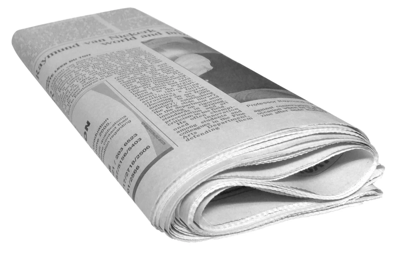 newspapers stacked on top of each other on white background