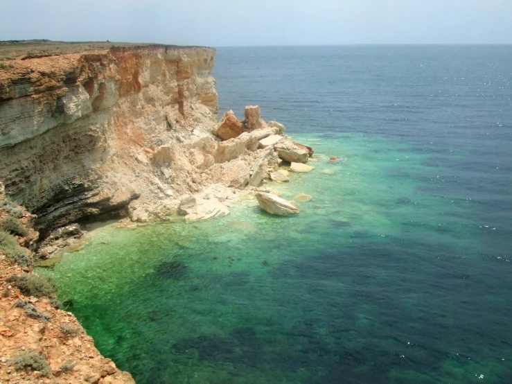 the cliffs of the beach are made from rock