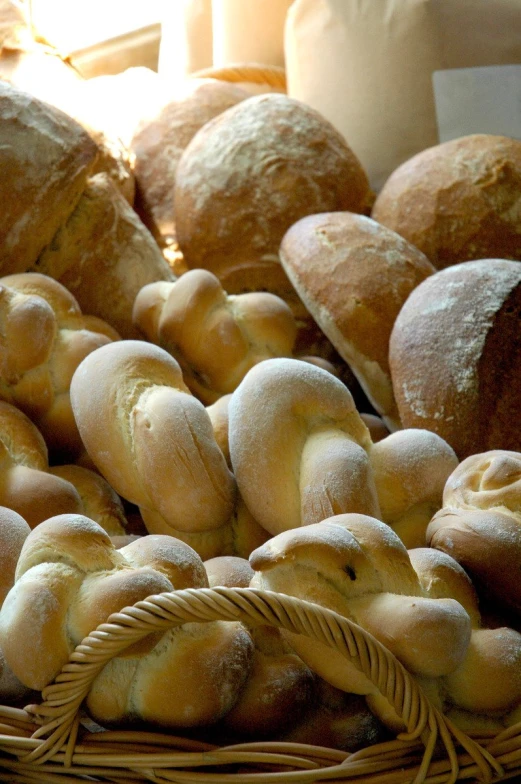 bread and rolls in a basket for sale