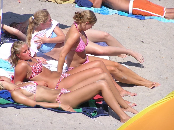 a group of young women laying on top of each other