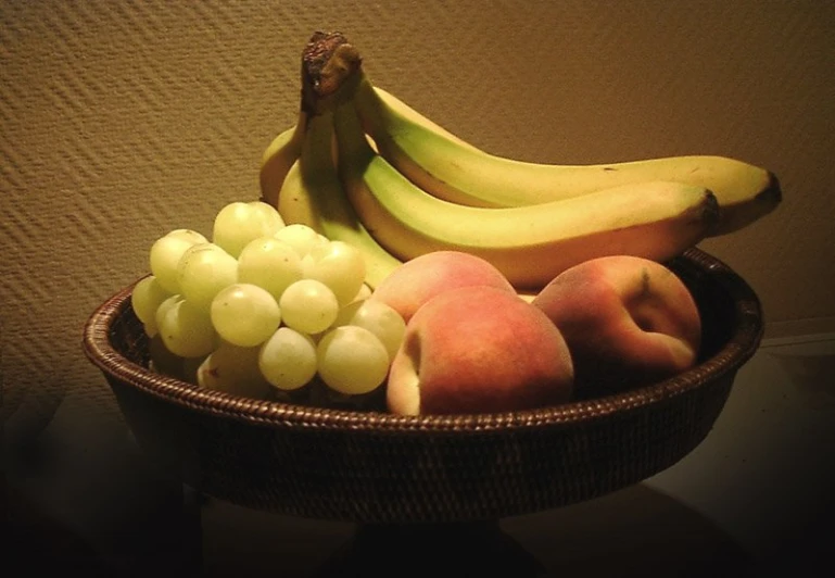 some bananas are on top of some other fruit