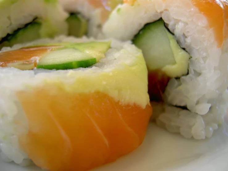 sushi rolls with cucumbers, peppers, and cheese