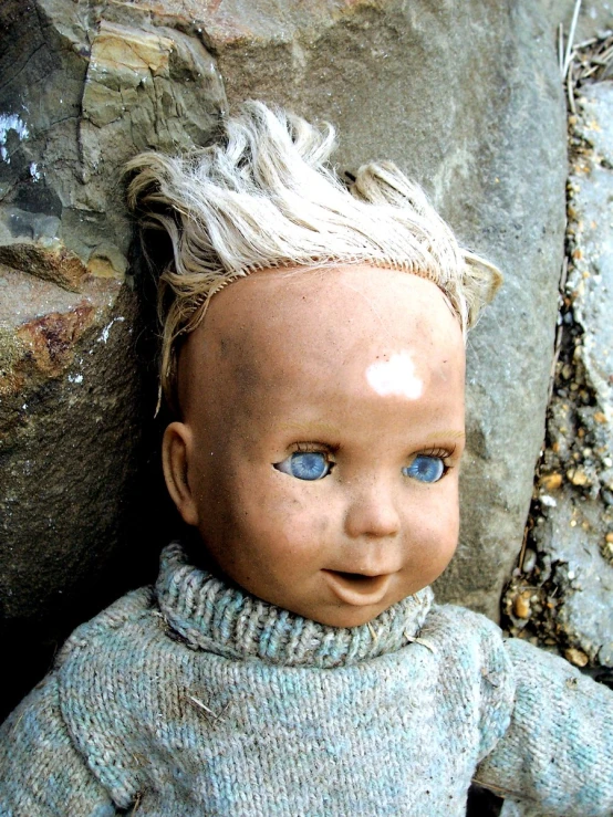 there is a closeup of a doll with blonde hair