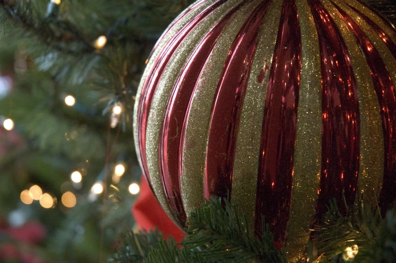 a close up of a christmas tree ball on top of it