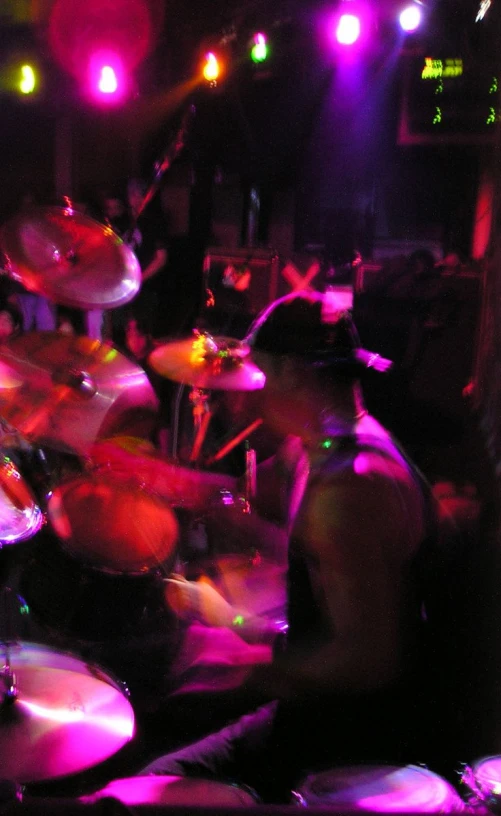 an image of drummers on drums in a dark room