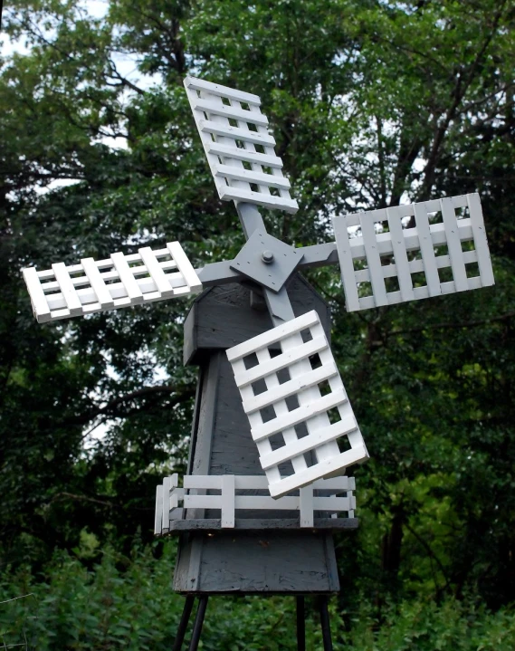 a sculpture made from white bricks in a grassy area