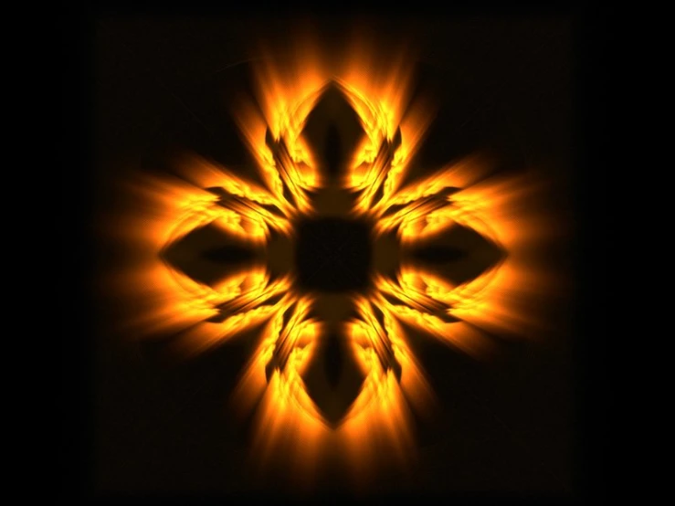 a sunflower like image in flames against a black background